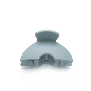 Matte light blue mini hair claw clip for kids with a smooth semi-circular design