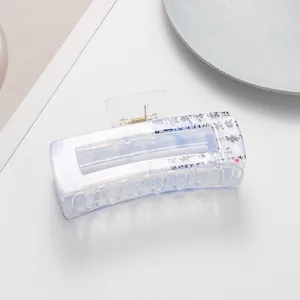 Detail of large marble texture hair claw clip with elegant Chinese calligraphy design
