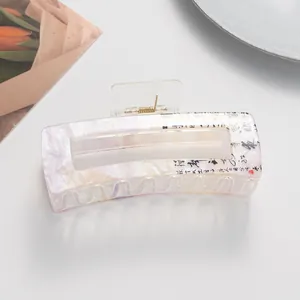 Detail of a rectangle hair claw clip with marble texture and Chinese calligraphy design