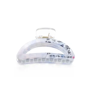 Blue marble patterned hair claw with Chinese calligraphy design and metal spring