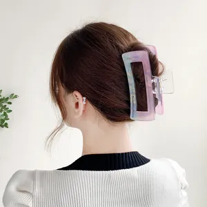 Large mermaid marble hair claw clip for thick hair shown on model in natural lighting