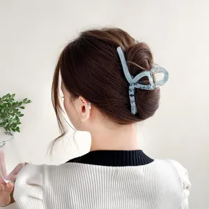 Blue aesthetic oversized hair claw clip with black calligraphy patterns for women's updos