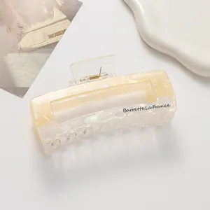 Detail of a rectangle claw clip with shell texture and Barrette La France lettering