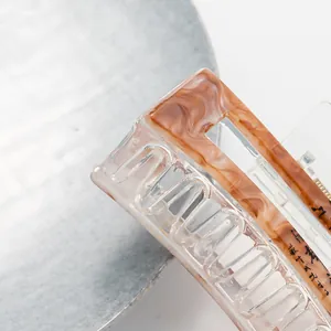 Minimalist amber marble rectangle hair claw clip with transparent acrylic base