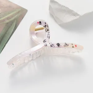 Detail of 13cm hair claw with iridescent resin texture and black Chinese calligraphy art