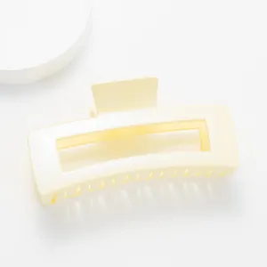 Close-up of a 12cm cream rectangle shark hair claw clip with a subtle pearly finish