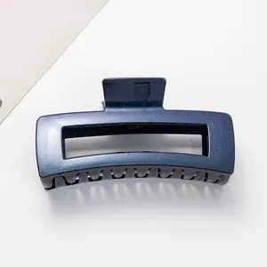Detailed view of the sparkling dark blue starry finish on a 12cm hollow hair claw clip