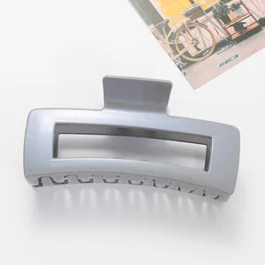 Macro detail of a 12cm large square shark hair claw clip in shimmering grey-blue finish
