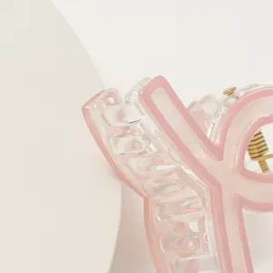 Pinza per capelli a forma di logo rosa in resina trasparente con molla dorata