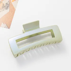 Close-up of a 12cm light green rectangular shark clip with a pearlescent finish