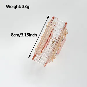 Pink transparent rectangular hair claw clip with floral details and 8cm size mark