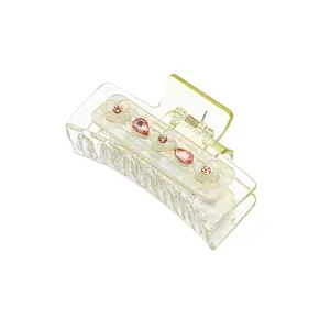 Transparent yellow flower hair claw clip with white petals and tiny crystals