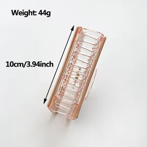 Pink rhinestone hair claw clip with gold trim measuring 10cm for elegant hair styling