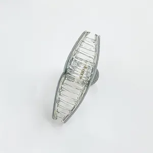 Detail of 13cm translucent gray shark hair claw clip showing teeth and metal spring