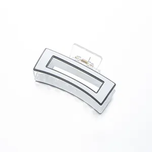 Minimalist square hair claw clip with white panel and black outline in a top-down view