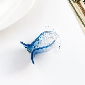 Macro shot of gradient blue claw clip with high-transparency finish and sturdy teeth
