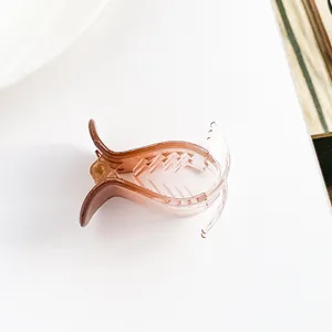 Detailed view of candy color hair claw clip with smooth resin gradient finish