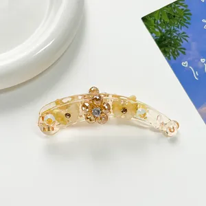 Détails de la pince à cheveux banane ambrée avec fleurs en cristal et motifs de papillons