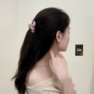 Pince à cheveux artistique en acétate marbré pour coiffures demi-attachées
