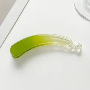 Macro detail of emerald green gradient banana hair clip with anti-slip inner teeth