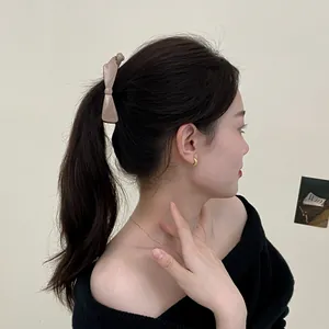 Elegant matte coffee bow banana clip holding high ponytail hairstyle for women