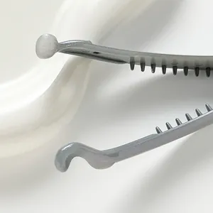 Elegant grey banana hair clip with glitter finish and interlocking teeth design