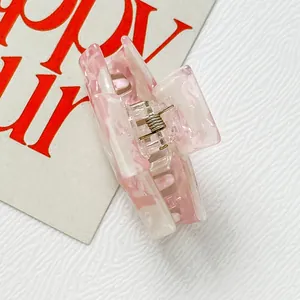 Pinza per capelli in acetato marmorizzato rosa e bianco con molla in metallo