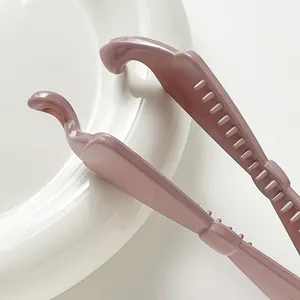 Glossy morandi pink large banana hair clip with anti-slip teeth shown in minimalist style