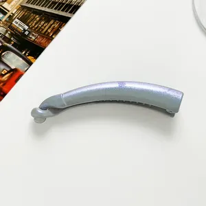Macro detail of silver glitter banana hair clip with internal teeth and glossy finish
