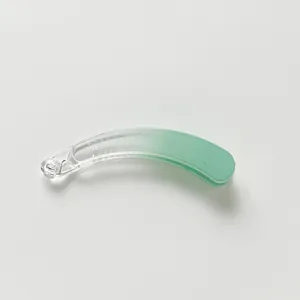 Detail of banana hair clip featuring a smooth translucent mint green gradient finish