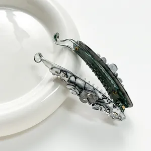 Banana hair clip set with marble patterns and green flower design for ponytail styling