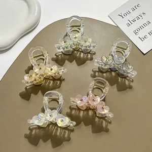 Five translucent heart claw clips with rhinestones in pastel colors for girls