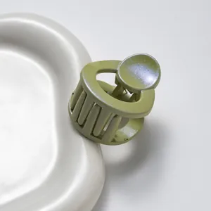 3.5cm round glitter claw clip in avocado green with pearl finish for hair styling