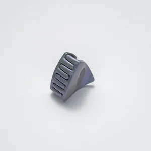 Macro shot of triangle mini hair claw clip with a pearlescent gray-purple glitter finish