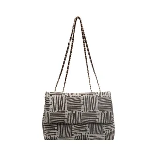 Large capacity woven crossbody bag with chain strap and geometric jacquard pattern
