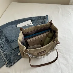 Retro khaki canvas tote bag with pearl chain and leather straps showing spacious interior