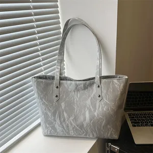 Minimalist marble pattern tote bag with large capacity for commuting on a sunny window sill