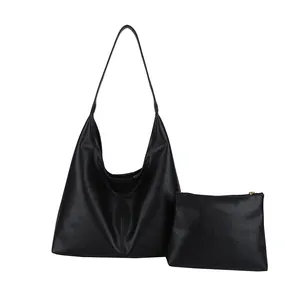 Large black minimalist tote bag and matching clutch set with pebbled leather texture
