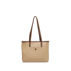 Grand sac fourre-tout beige minimaliste avec anses marron et poche avant pour le quotidien