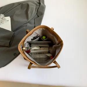 Brown checkered tote bag with large capacity for laptop and daily essentials