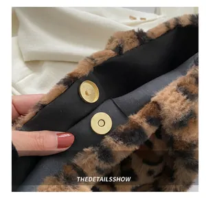 Close-up of leopard faux fur bag featuring a gold magnetic closure and plush texture