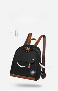 Lightweight 0.47kg black oxford fabric commuter backpack with leather accents and feather icon