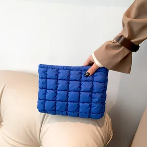 Blue quilted puff clutch bag with cloud stitch design and large capacity storage