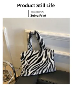 Detailed view of the soft zebra print plush handbag with thick integrated handle