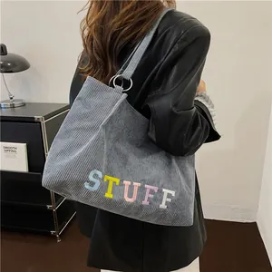 Blue-grey corduroy tote bag with colorful STUFF embroidery for daily commute use