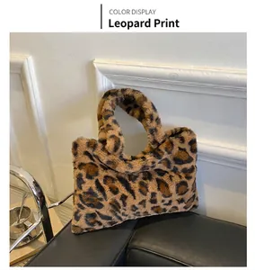 Detail shot of leopard print plush handbag with soft faux fur texture and top handle