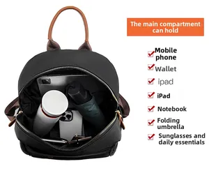 Spacious interior of black nylon backpack showing storage for iPad and daily essentials