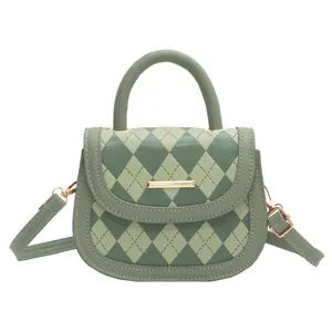 Minimalist green argyle saddle bag with top handle and gold hardware crossbody strap