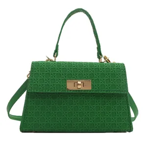 Green woven texture crossbody bag with golden metal buckle clasp and top handle