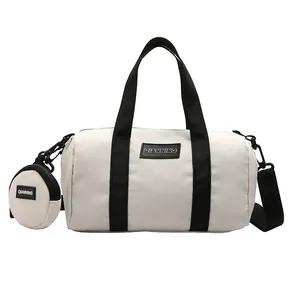 White nylon Boston bag with black strap and matching round coin purse for daily commute